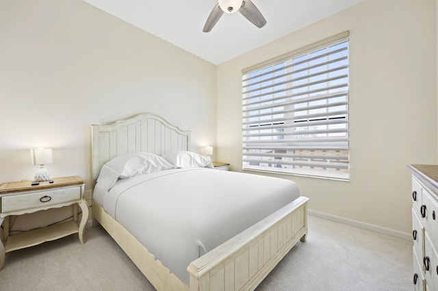 bedroom with light colored carpet and ceiling fan