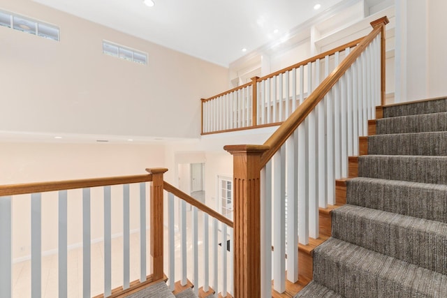 staircase featuring wood-type flooring