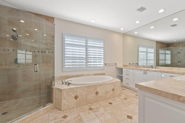 bathroom featuring vanity, tile patterned flooring, and independent shower and bath