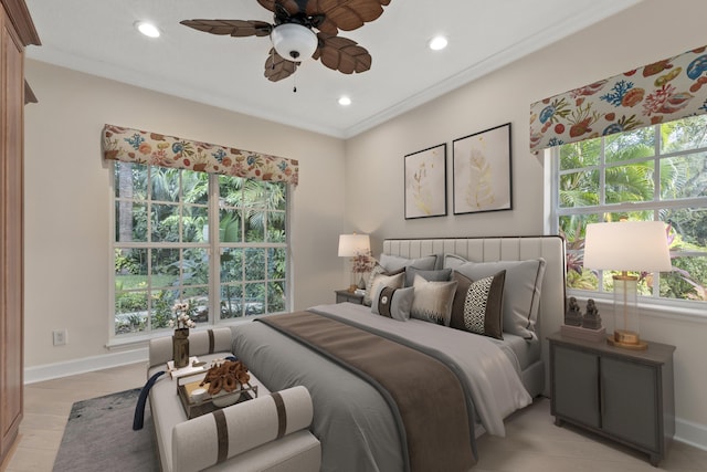 bedroom featuring light wood-type flooring, ceiling fan, and crown molding