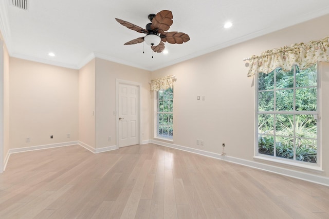 unfurnished room featuring ceiling fan, ornamental molding, and light hardwood / wood-style flooring