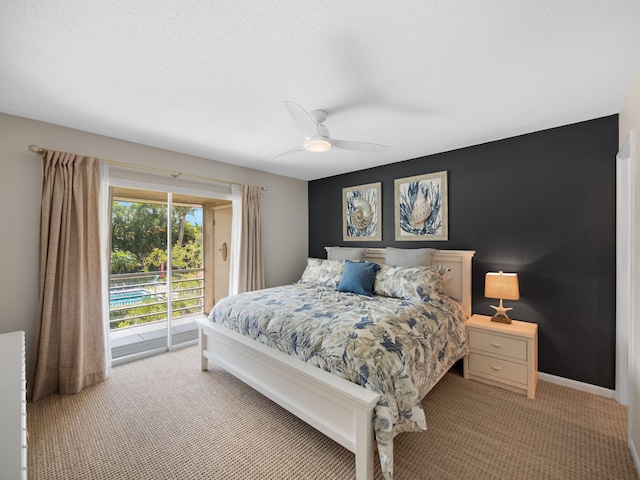 bedroom featuring access to outside, ceiling fan, light carpet, and a textured ceiling