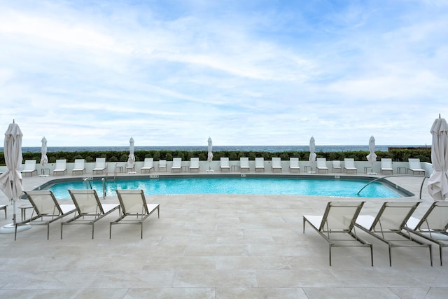 view of swimming pool featuring a patio area