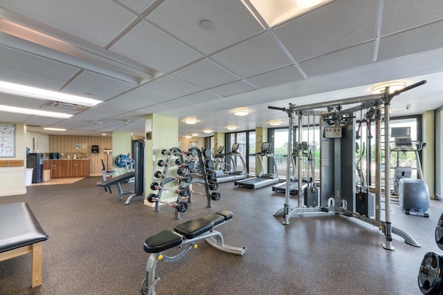 exercise room featuring a paneled ceiling