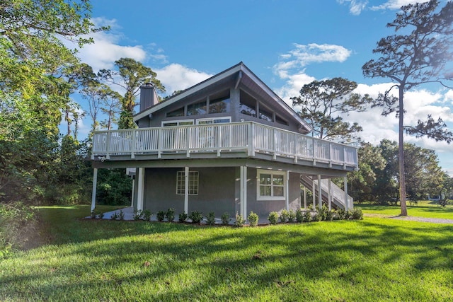 exterior space featuring a yard and a deck