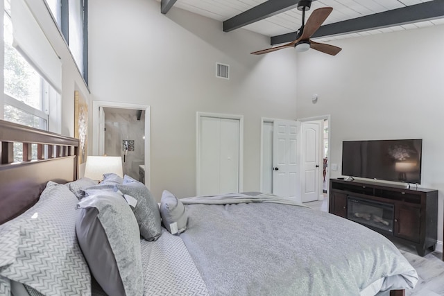 bedroom with wooden ceiling, high vaulted ceiling, ceiling fan, beamed ceiling, and light hardwood / wood-style floors