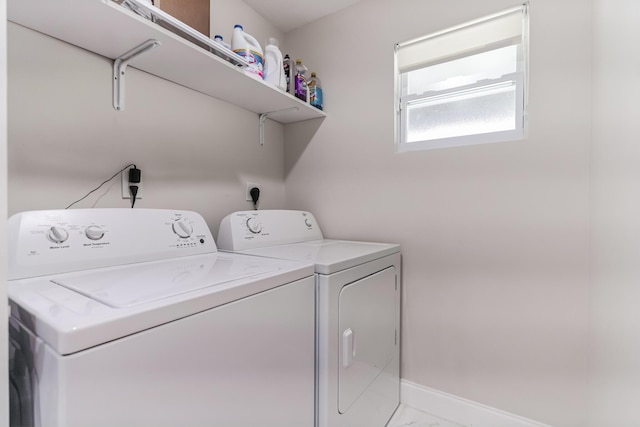 clothes washing area featuring washing machine and dryer