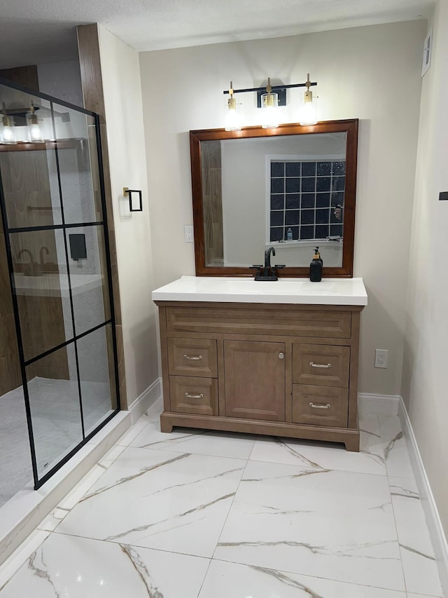 bathroom featuring vanity and a shower with shower door