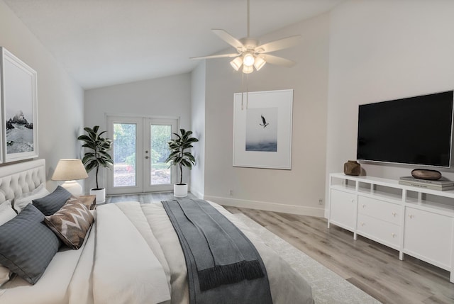 bedroom featuring ceiling fan, french doors, access to exterior, high vaulted ceiling, and light hardwood / wood-style floors