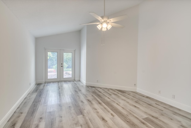 spare room featuring ceiling fan, french doors, light hardwood / wood-style flooring, and high vaulted ceiling