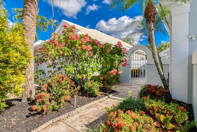 view of front of property with a garage and a front lawn