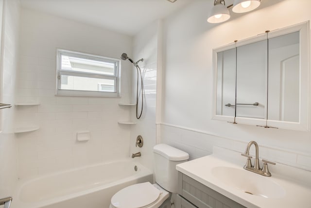 full bathroom with tiled shower / bath combo, toilet, vanity, and tile walls