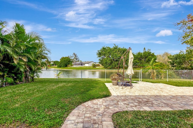 view of yard featuring a patio and a water view