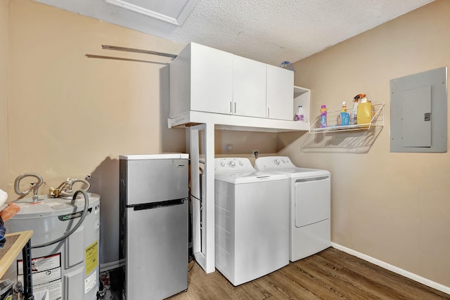 laundry area featuring cabinets, a textured ceiling, washer and clothes dryer, hardwood / wood-style floors, and electric panel