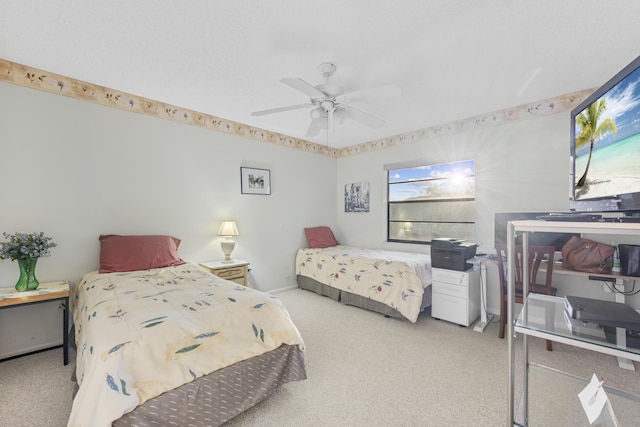 bedroom with ceiling fan and carpet floors