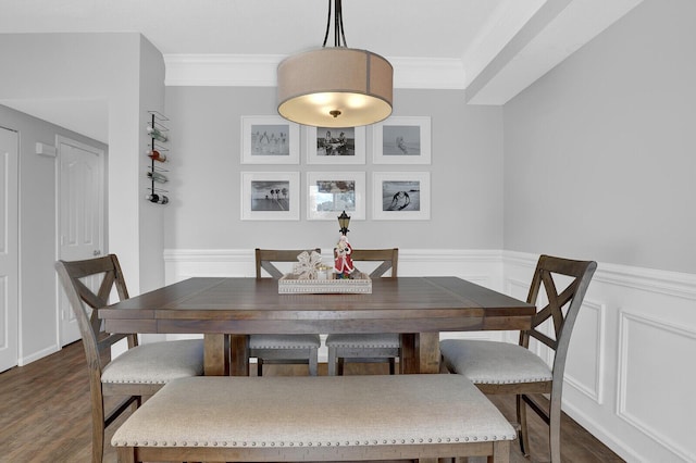 dining space featuring dark hardwood / wood-style flooring and ornamental molding