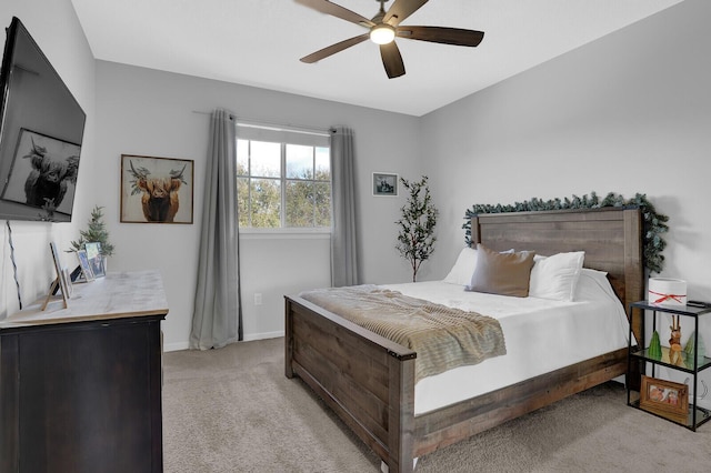 bedroom featuring ceiling fan and light colored carpet