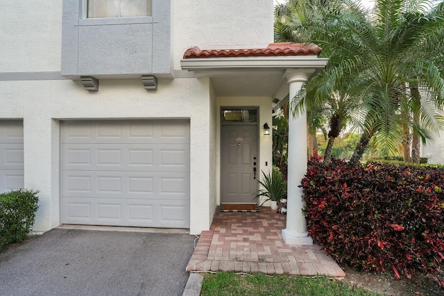 entrance to property featuring a garage