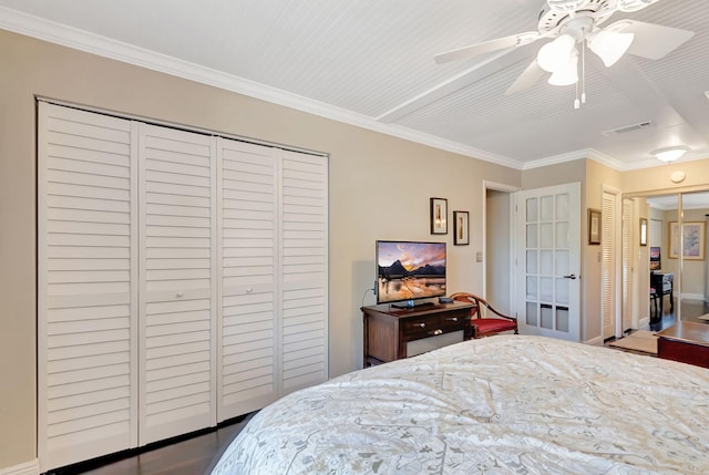 bedroom with ceiling fan and ornamental molding