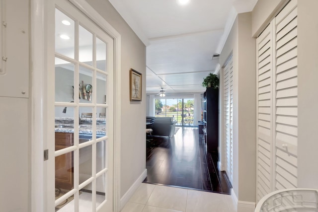 corridor with light tile patterned floors