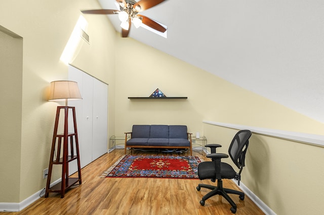 office space with ceiling fan, wood-type flooring, and lofted ceiling