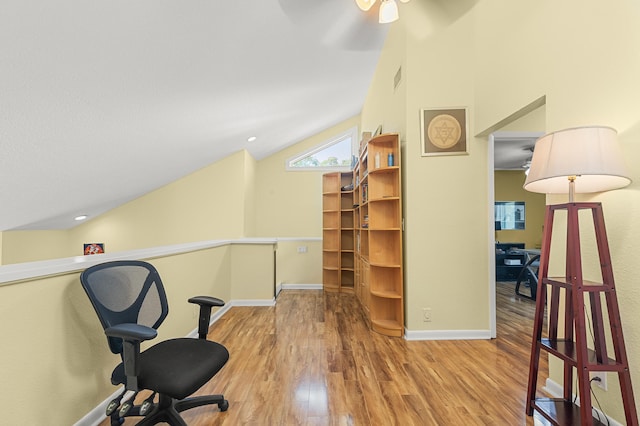 office featuring ceiling fan, lofted ceiling, and wood-type flooring