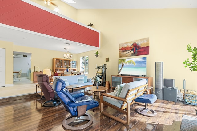 living room featuring a large fireplace, high vaulted ceiling, and dark wood-type flooring