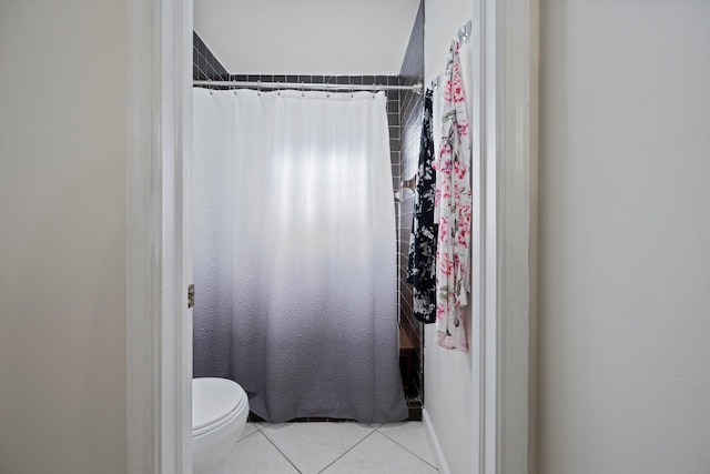 bathroom with tile patterned floors and toilet