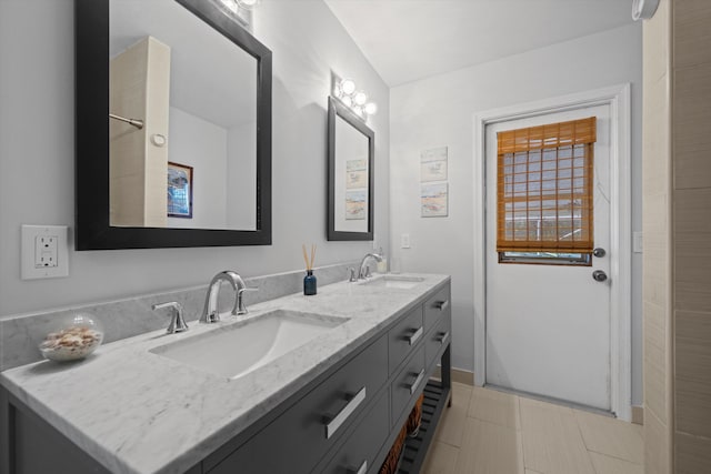 bathroom with tile patterned floors and vanity