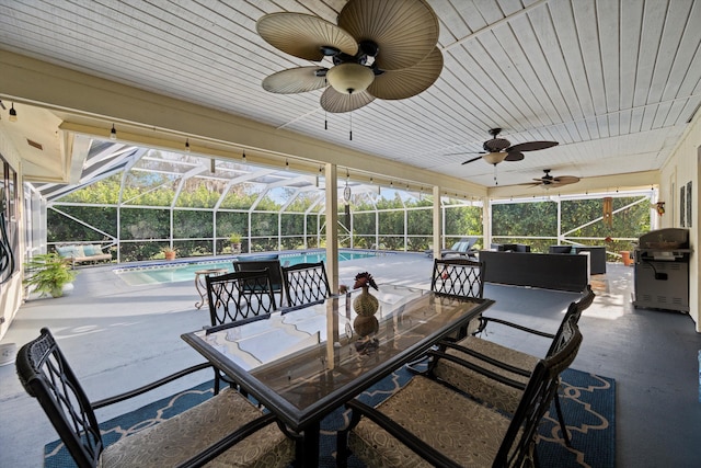 view of patio / terrace featuring a lanai and grilling area