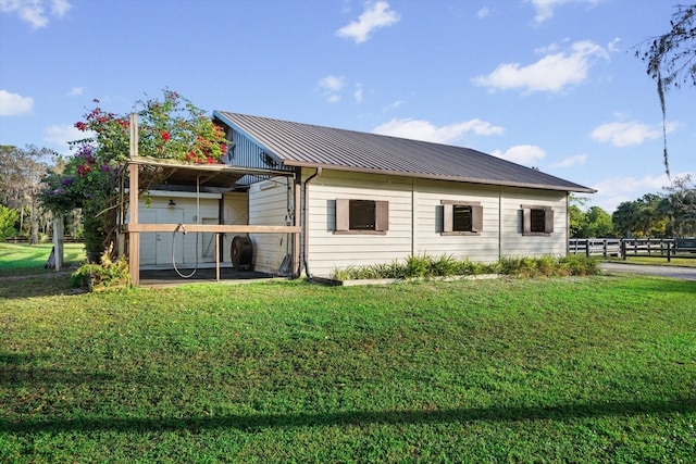 rear view of house with a lawn