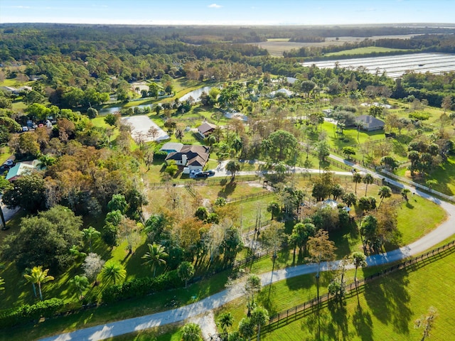 drone / aerial view with a water view and a rural view