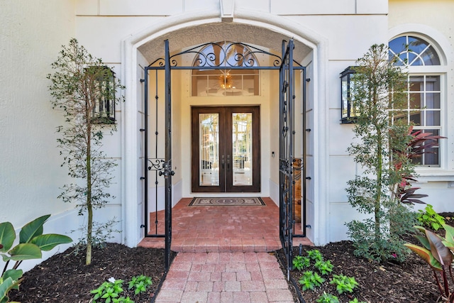 property entrance featuring french doors