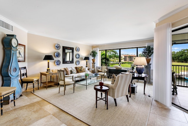 living room featuring ornamental molding and light tile patterned floors