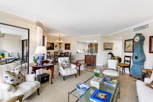 living room featuring crown molding and a chandelier