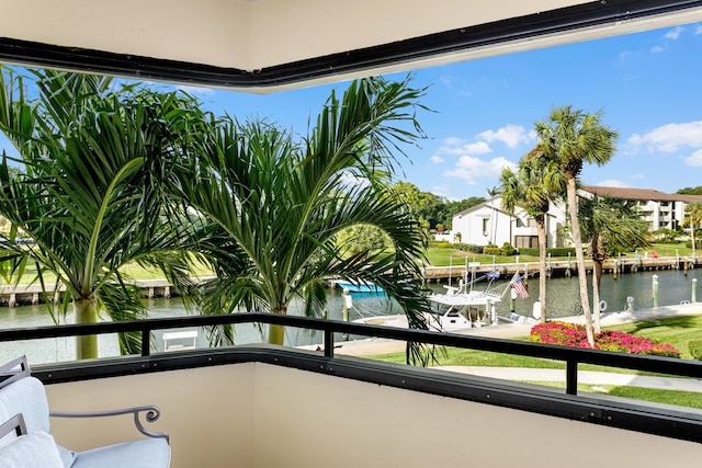 balcony featuring a water view