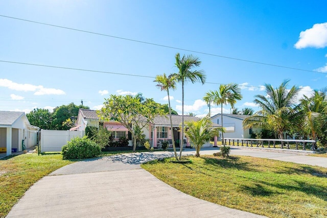 view of front facade with a garage and a front lawn