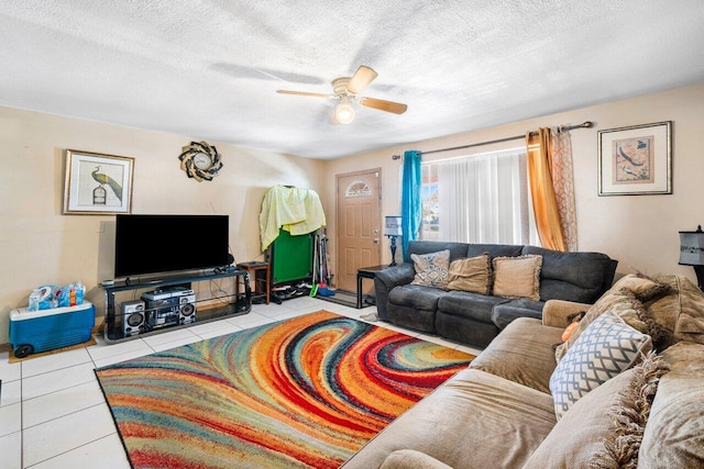 tiled living room featuring a textured ceiling and ceiling fan