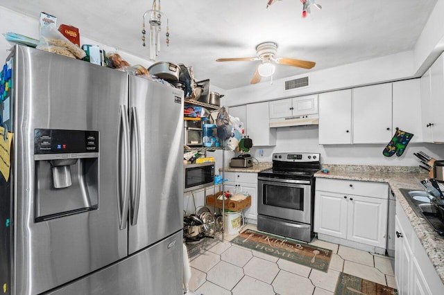 kitchen with ceiling fan, sink, stainless steel appliances, light stone counters, and white cabinets