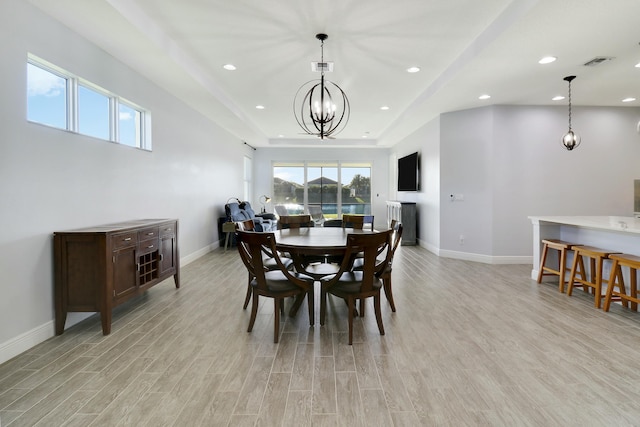 dining space featuring light wood-style floors, baseboards, visible vents, and recessed lighting