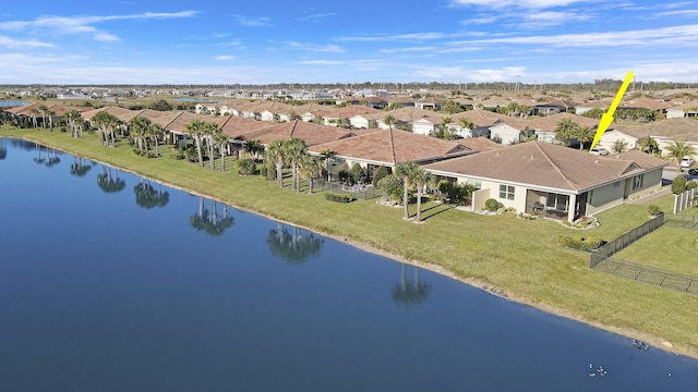 bird's eye view with a residential view and a water view