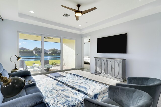 bedroom with ceiling fan and light colored carpet