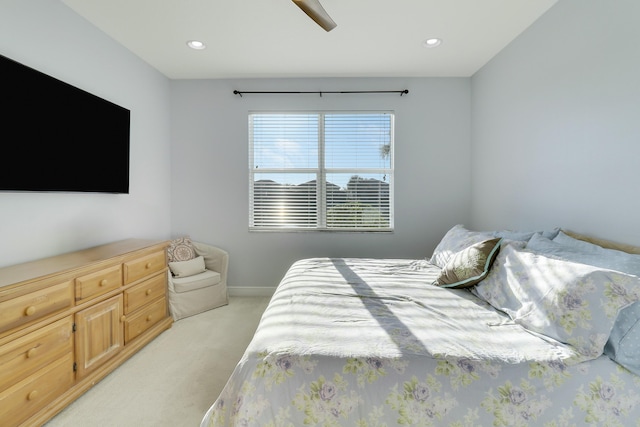 bedroom with light carpet, baseboards, a ceiling fan, and recessed lighting