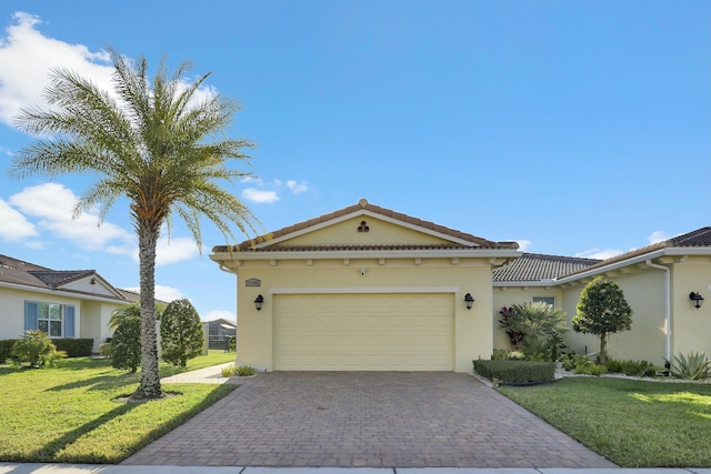 view of front facade with an attached garage, stucco siding, decorative driveway, and a front yard