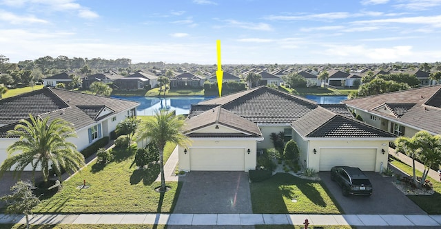 aerial view with a water view and a residential view