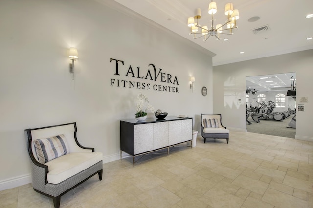 reception with an inviting chandelier and visible vents