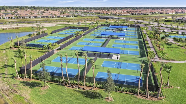 birds eye view of property with a water view and a residential view