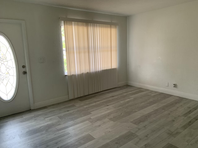 entryway with light hardwood / wood-style floors