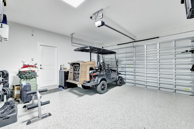 garage featuring a garage door opener