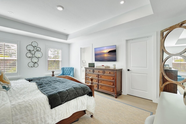 bedroom featuring a tray ceiling